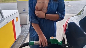 she is refueling at the gas station, showing her tits and pussy