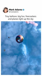 A small hot air balloon with firecrackers and miniature planes is launched, creating colorful smoke trails | Markadams