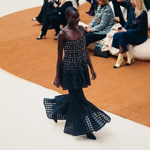31K views · 3K reactions | In airy layers of suspended volume, a flounce top in black houndstooth lace with cascading gemstone embroidery is worn over a matching flared mermaid skirt. The CHANEL Spring-Summer 2022 Haute Couture collection. See all the looks at chanel.com/-HC_SS22 | CHANEL | Facebook