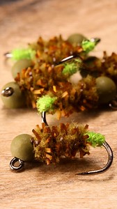 Cheey Cased Caddis Materials List: Hook: Ahrex 555 size 14-16 Bead: Slotted sized to hook Hot Spot: Chartreuse SLF dubbing Body: Fulling Mill Chewy Worm Chenille (Micro) | The Tao of Flies