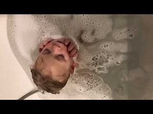 Little Boy Dozes off While Sitting in Bath Tub - 1039084