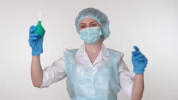 A female colorectal surgery doctor is showing a clyster, or rectal...