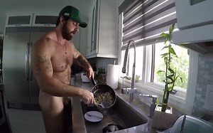 Hairy muscle god cooking in nature's garb