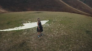From the Alexander McQueen Spring/Summer 2019 campaign. A black portrait neck silk knit dress with red feather stitch embroidery, a crinoline skirt and metal fastenings. Video by Masha Vasyukova. Discover: bit.ly/SS19MCQUEEN | Alexander McQueen