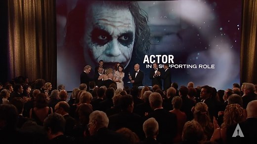 Heath Ledger's parents, Kim Ledger and Sally Bell, and sister Kate Ledger accepting the Actor in a Supporting Role Oscar on Ledger's behalf for his performance as the villainous Joker in Christopher Nolan's 'The Dark Knight.' Check back every day for a new moment and watch the #Oscars LIVE on Sunday, March 12th at 8e/5p! 14 days til #Oscars95 | The Academy