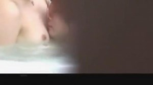 Japanese couple in hotel Jacuzzi