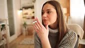 A young girl woman lights a cigarette, she is under stress and the...