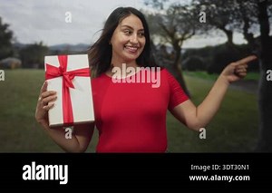 woman holding red Apple and smiling on white background