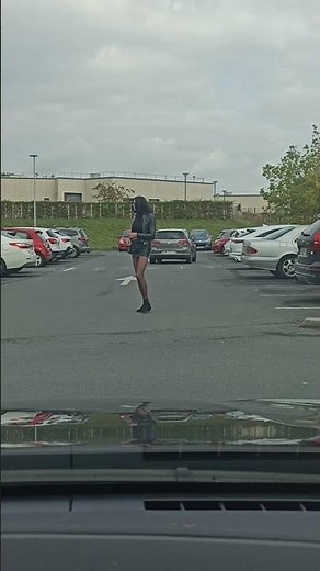 Sexy crossdresser in full parking