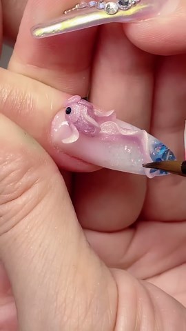 Satisfyingly 3D Glittery Purple Fish Nail Art