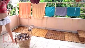Naked laundry. The maid is drying clothes in the laundry.