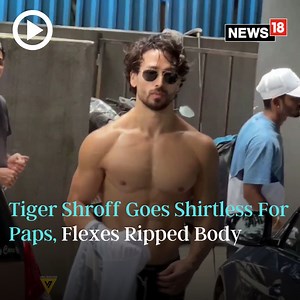Bollywood star and fitness freak Tiger Shroff goes shirtless for paps and flexes his ripped body! #Watch #bollywood #tigershroff #bodybuilder #gym #fitness | News18
