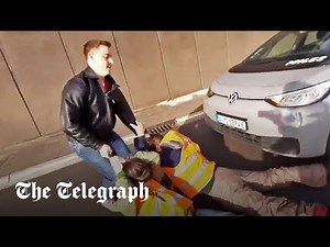 Drivers drag climate activists off streets in Berlin