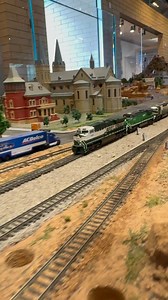 Two custom painted BNSF Gevos lead a container train across the Sun N Sand N Scale model train layout in Scottsdale AZ. #train #trains #nscalemodeltrains #nscale #customtrains #railfanning #trainlayout #bnsf #nscaletrains #modeltrains #freighttrain | Garret Hauser