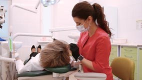 Minsk, Belarus - November 21, 2019.Young Woman Dentist in a Red Suit Examines a Patient Stock Video - Video of dental, care: 167583961