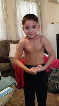 Flexing, ripped 7 year old