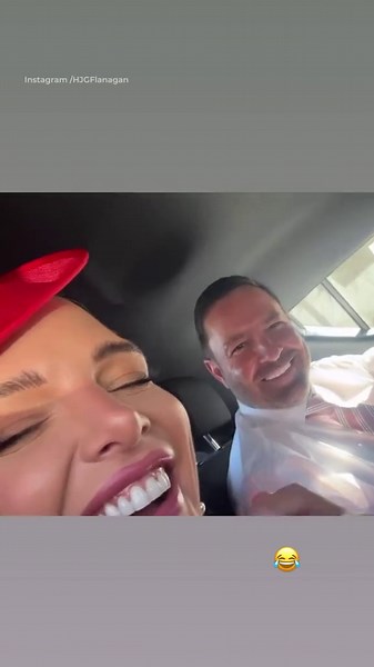 Helen Flanagan cuddles up to Robbie Talbot en route to races at Aintree