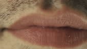 Male lips chewing gum. Closeup on mouth.