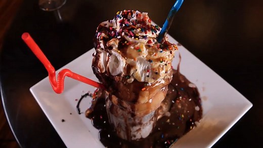 Churros, Flan, and an insane Oreo milkshake topped with donuts. This dessert is absolutely unforgettable. | Phantom Gourmet