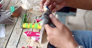 clip-1097572689-fastening-small-pieces-wood-larger-boards-hot