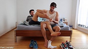 Gay friends playing with feet, socks and shoes