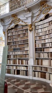 Would you like to browse through this magnificent library? This Baroque room is the heart of the largest monastery library in the world. It belongs to the Benedictine Admont Abbey in Austria. The library room is 70 meters long and houses over 70,000 books. The entire stock of the Abbey comprises around 200,000 volumes. 📍 Admont, Austria 🎥 instagram.com/madelinestraveling | DW Travel