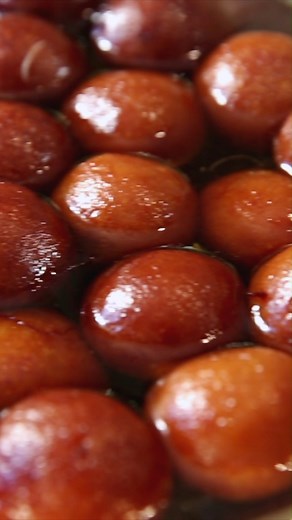 Make this famous Indian dessert - Gulab Jamun at home Ingredients: For Sugar Syrup 1 ½ cup Water 2 ½ cup Sugar Saffron ¼ tsp Green Cardamom powder For Gulab Jamun 2 cups Hariyali Mawa 3 tbsp Milk powder 3 tbsp Arrowroot powder ¼ cup All-Purpose Flour Ghee for frying Method of preparation: For Sugar Syrup In a vessel containing water, add sugar, cook it until it forms one thread consistency. After switching off the flame add few strands of saffron, green cardamom powder, mix well. For Gulab Jamun