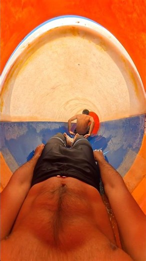 POV chasing someone inside giant waterslide
