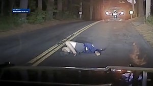 Dashcam video shows drunken teen passed out in middle of road, police say