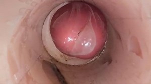 The camera in the deep pussy records a huge ejaculation of sperm into the condom