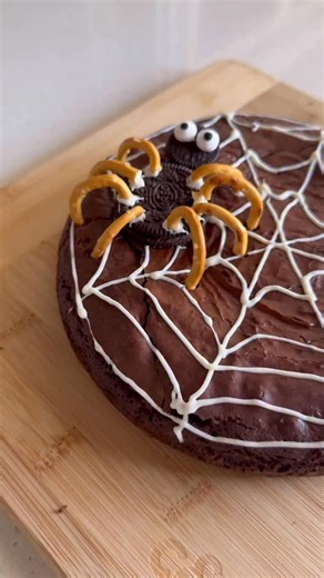 Part four of my Halloween baking series: Spiderweb Brownies Made from a simple boxed mix but decorated to impress. That little Oreo spider totally stole the show (and the kids fought over who got to eat it 🕸️). So fun, so easy, and perfect for any Halloween party. #SpiderwebBrownies #HalloweenBaking #EasyHalloweenDessert #FamilyBakes #SpookySeason | Eisha-Marie Eisel