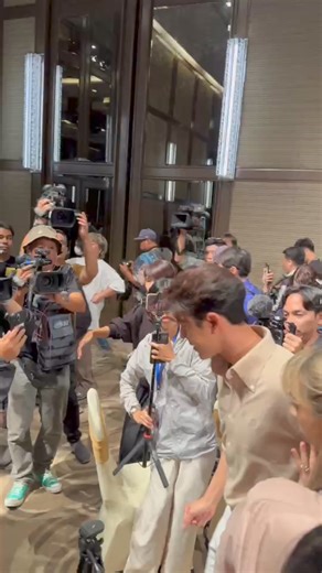 Naphat Siangsomboon walked out of the press room in tears after holding a press conference. He admitted to breaking up with his girlfriend, Baifern Pimchanok, a famous actress. | Khaosod English