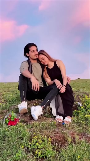 Romantic Sunset Moments on a Grassy Hilltop