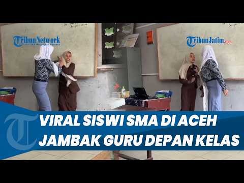 A high school student in Aceh went viral after grabbing her teacher's hijab and pulling his colla...