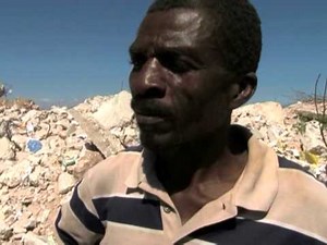 Haiti quake victims search the debris for precious objects