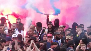 Barcelona fans mistakenly throw objects at their OWN team bus as they clash with police in violent scenes outside the stadium ahead of Champions League showdown with PSG