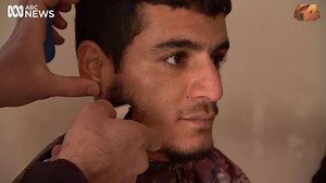 The young men in this Iraqi village have waiting a long time to visit the barber shop. Freed from Islamic State control by the Iraqi Army, the people of East Mosul can look forward to a new beginning. Watch a special report from the battlefields of Iraq - on Monday's Four Corners. | Four Corners