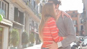 clip-3423851-young-couple-hugging-outdoors-city-while-on