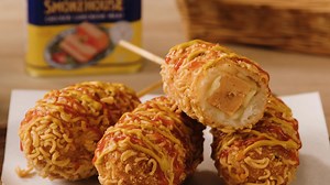Give your snack time a bold makeover with these Ramen-Crusted Luncheon Meat Corn Dogs! 🌭🍜 Made using Royal Smokehouse Chicken Luncheon Meat wrapped in gooey mozzarella, then coated in crushed Hana Dried Pollock Ramen and fried to crisp perfection, this playful creation combines comfort food with a crunchy noodle twist. A drizzle of mustard and ketchup adds tang and sweetness, while a chilled glass of Welch’s Grape Soda ties it all together for the ultimate treat. Pick up everything you need at