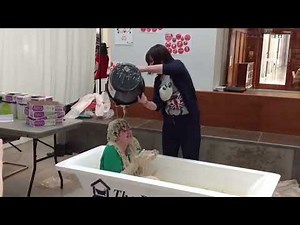 Girl gunged in a bath of porridge