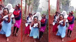 "Haikua rahisi": Heartwarming moment as woman carries bride across muddy path