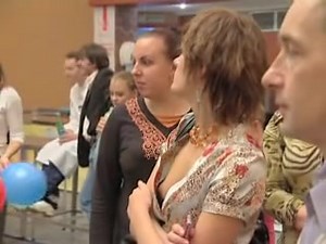 Peeking down the blouse of girl in the crowd