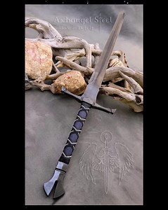 3D Crossguard Longsword in Blue Leather with Silver Chain Enhancement. She also has a black oxide finished blade. Handcrafted by us in Detroit Lifetime Warranty against Breakage #sword #longsword #swordartonline #swords #blade #blades #bladesmith #swordsmith #detroit #ArchangelSteel #madeindetroit #detroitartist #detroitart #steel #steelart | Archangel Steel