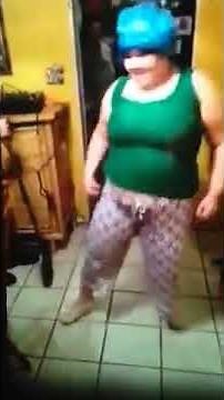 Girl in shower cap dancing with broom