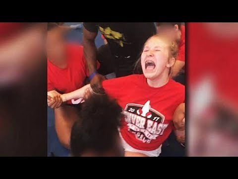 Cheerleader Screams As Teammates Force Her Into Split (VIDEO)