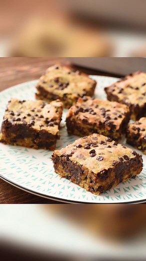 These Chunky Monkey Brownies combine both chocolate AND bananas into a favorite sweet treat! Simple to make and a crowd pleaser, what are you waiting for?!?! Recipe>> https://thecookinchicks.com/chunky-monkey-brownies/ | The Cookin' Chicks