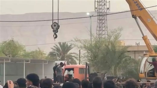 Iran hangs murderer from crane in front of ghoulish crowd including kids