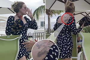 Adele looks slimmer than ever as she shows off her back tattoos on holiday with Harry Styles