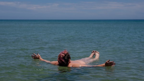 The nudists baring it all to address misconceptions about naked beach culture