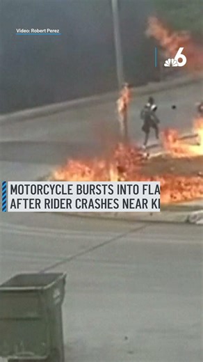 Motorcycle bursts into flames after rider crashes near kids